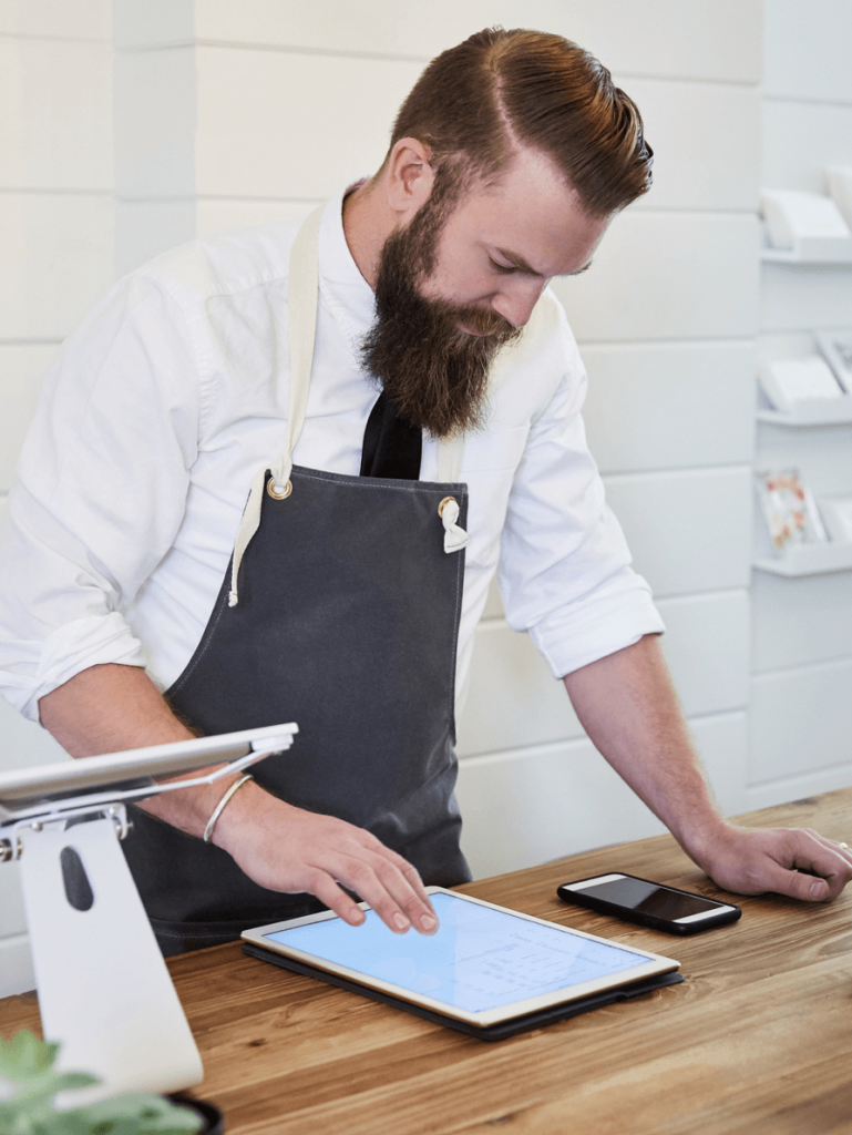 Retail employee using iPad in store